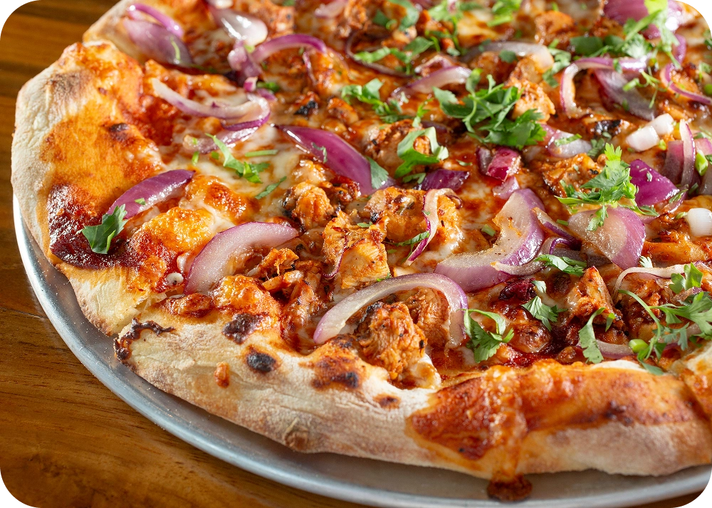 Delicious pizza garnished with herbs